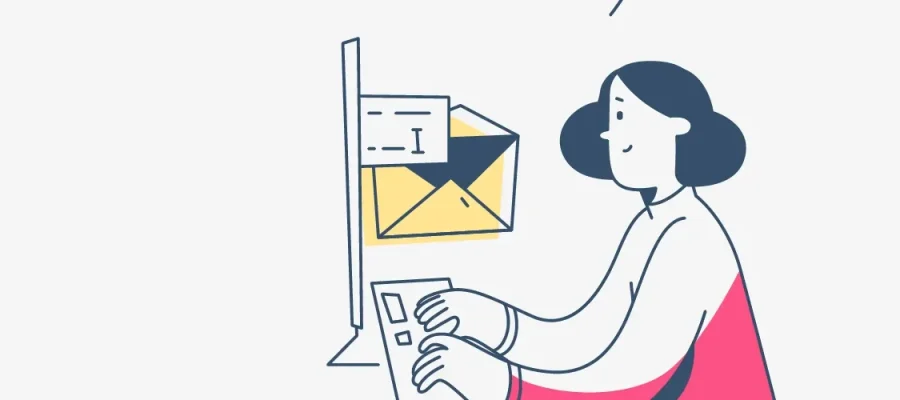 susam A simplified illustration of a person with dark hair and a pink shirt typing on a keyboard at a computer. Behind the monitor is a large yellow envelope, symbolizing email or digital communication, against a plain light background.
