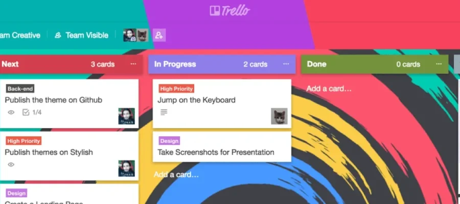 susam A colorful Trello board is shown with columns titled Backlog, To Do, In Progress, Done, and On Hold. Various cards in different colors display tasks, priorities, and labels. The background features an abstract, multicolored design.