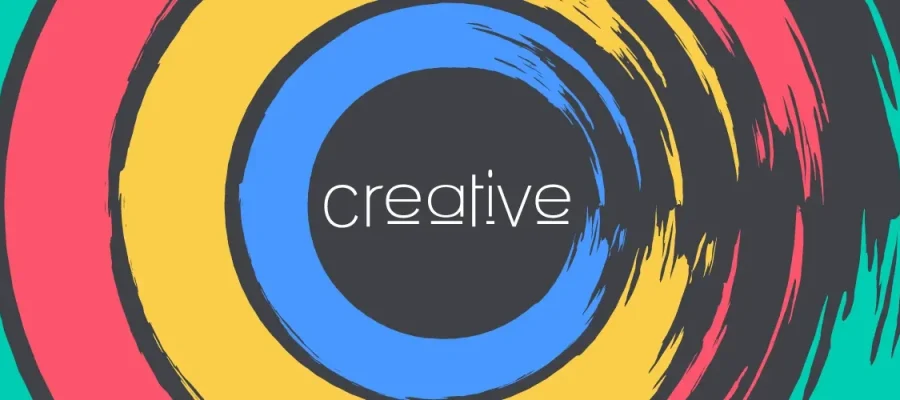 susam Abstract digital image with circular brushstroke patterns in vibrant colors—purple, teal, red, yellow, and blue—surrounding a black circle. The word “creative” in lowercase white text appears in the center, partially underlined by a white line.